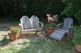 Classic garden seating in rustic weathered wood.