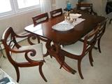 Drexel mahogany dining room includes lyre-base table with 5 leaves and pads, plus 6 newly upholstered chairs. Table with no leaves measures 62" x 42".