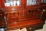 Top center drawer of hutch folds down as writing desk.