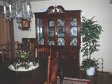 China cabinet with Royal Albert "Enchantment" China, crystal, sterling candlesticks, etc. Northwood Carnival Glass punchbowl set is on the table.