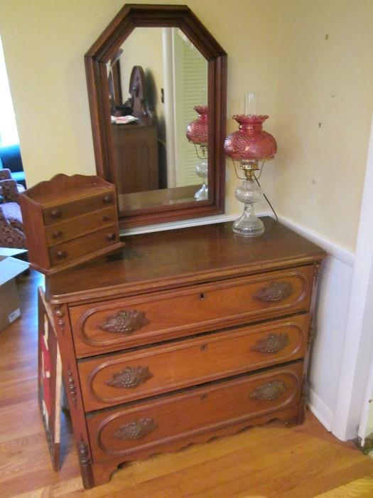Victorian walnut chest of drawers with mirror above. lamp and min. dresser.