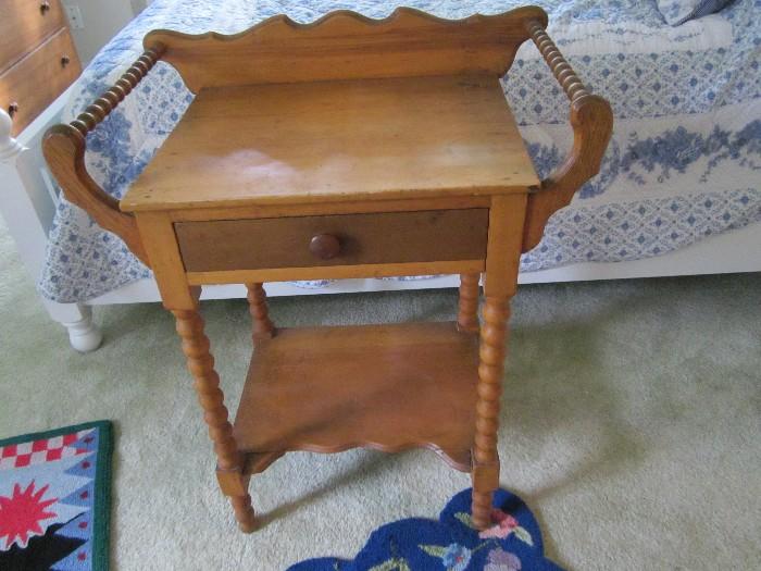 Antique washstand with towel bars.