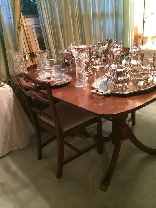 Dining table; lovely tea service; many silver plate serving pieces;