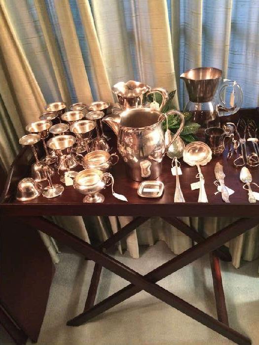  Butler's tray table; some of the silver plate serving pieces;