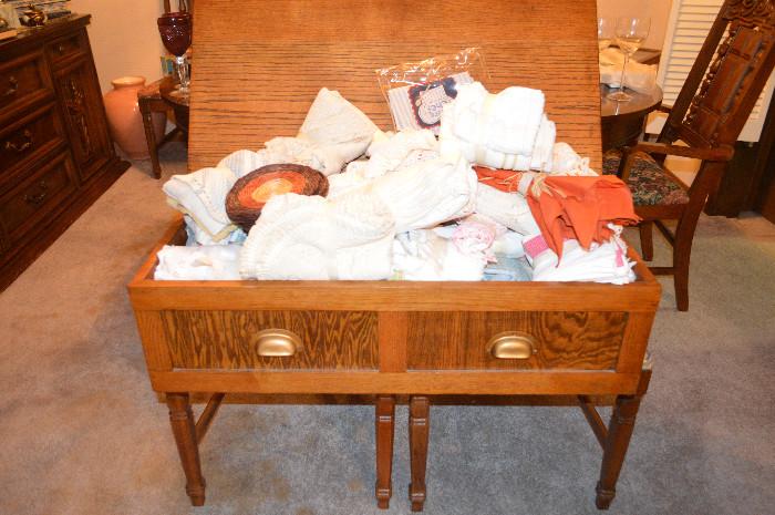 Table linens in wood chest