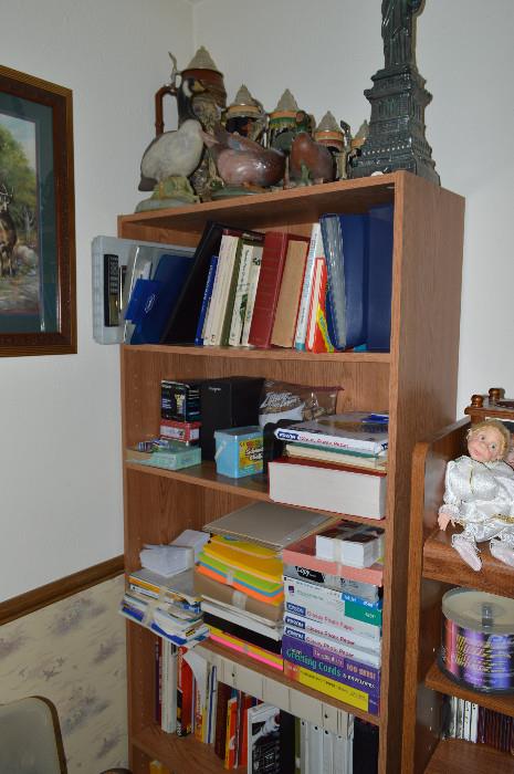 steins, office supplies and bookshelf