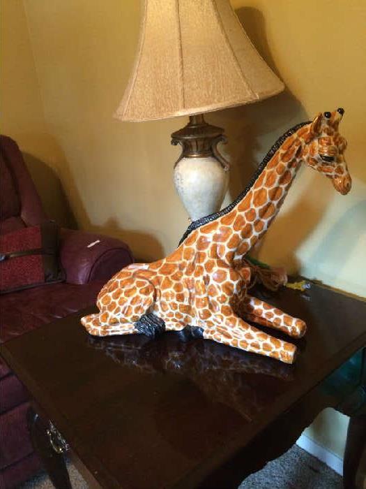                     Decorative giraffe and side table