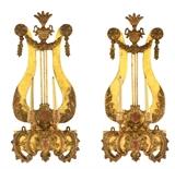 LOT 11: A PAIR OF FRENCH NEOCLASSICAL GILTWOOD TWO-LIGHT SCONCES
