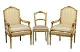 LOT 46: A PAIR OF FRENCH LOUIS XVI STYLE UPHOLSTERED GILTWOOD FAUTEUILS, TOGETHER WITH AN ASSOCIATED SIDE CHAIR
