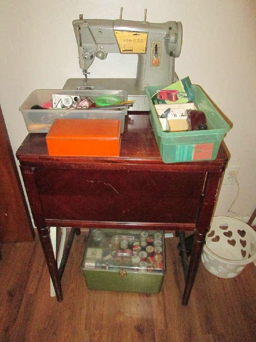 Singer sewing machine and also Kenmore sewing machine in cabinet