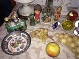 Glass grapes, child figurine is Goebel and glass paperweights.