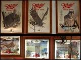 Mirrored Miller and Old Millwakee beer signs