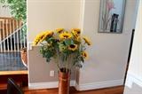 Revere Ware copper pail with faux sunflowers