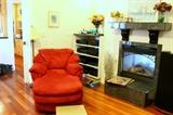 Red microsuede lounger chair and LOTS of electronics