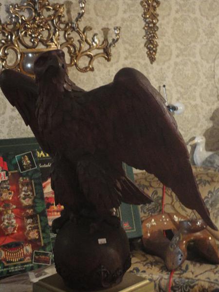 Oak sculped eagle, very large 3' high on base with ball and claw feet. This item may be sold to beneficiaries prior to sale. If sold picture will be removed.