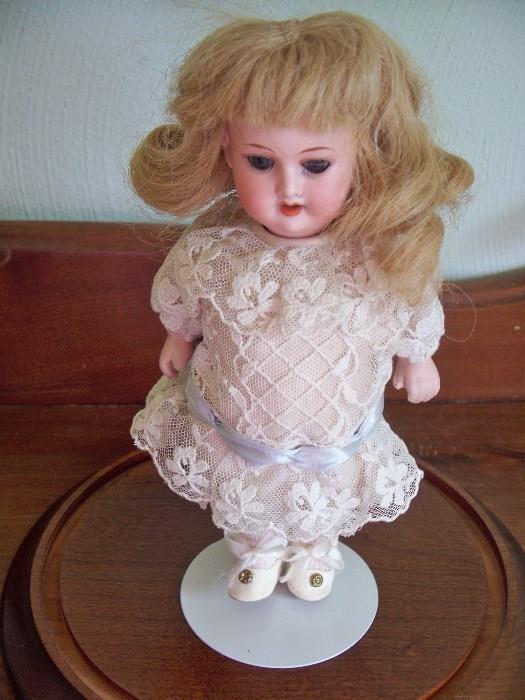 Bisque doll, with teeth and open and shut mouth.