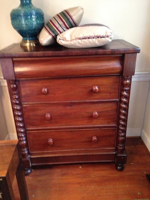 Antique Empire Chest of Drawers in Mahogany with Carven Scroll Pediments on Bun Feet.