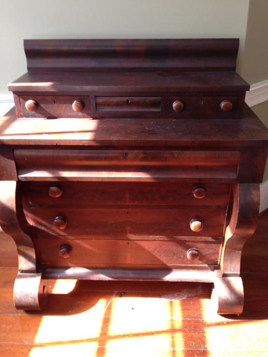 Antique Flame Mahogany Empire Three-over-Four Chest of Drawers with Scroll Accents