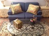 Slate blue loveseat, Karges chests, oval oil rubbed bronze finish coffee table, carrera marble lamps, beautiful large handmade Persian rug 