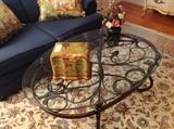 Fancy scrolling motif oil rubbed bronze finish Classic European style oval glass top coffee table, beautiful handmade large wool Oriental rug, Peking glass Chinese bouquet of flowers in bronze Cooley cart vase