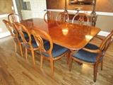 Henredon dining table with 8 chairs and 2 leaves.  Pads are available for the table with one leaf in use.