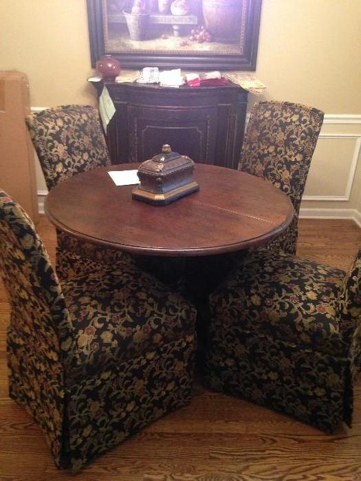 Dining room table with 4 fabric covered chairs