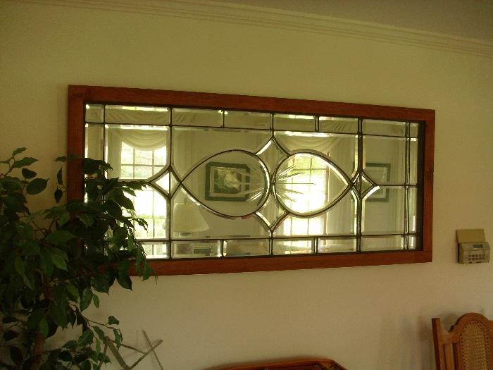 beveled glass mirror with wooden framing