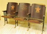 Vintage Theater Seats with Advertising Slogan.