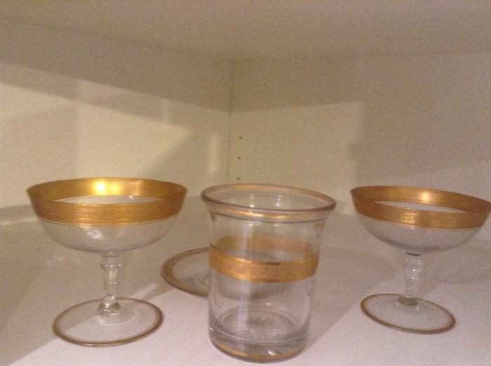 Gold rimmed glasses and dishes
