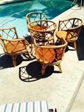 Dining room set of 4 bamboo chairs with matching table... Chairs swivel. Comes with cushions