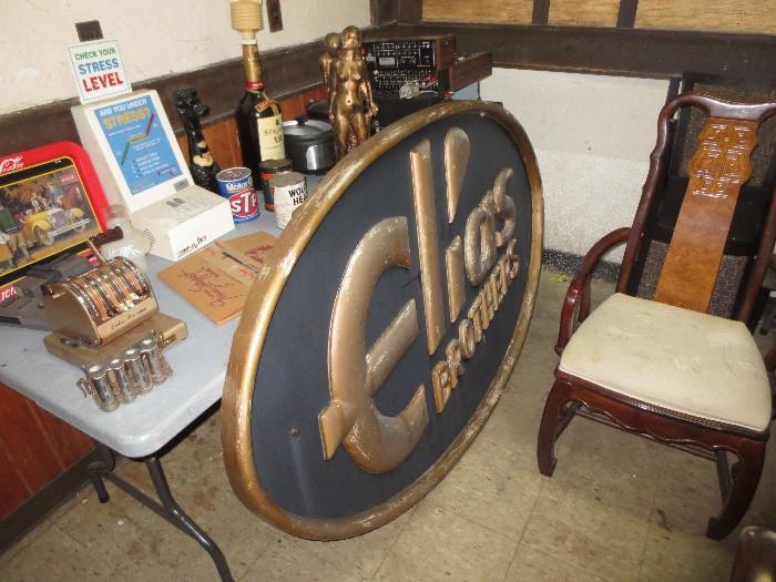 Elias Brothers sign, chair to dining table