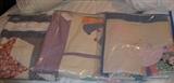 three unfinished quilts, lot of fine linen tablecloths, quilts, sheets and more