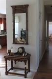 antique table, mantle clock, midcentury modern mirror