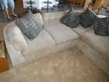 This sweet couch has an unusual design - a wrap around cozy feel