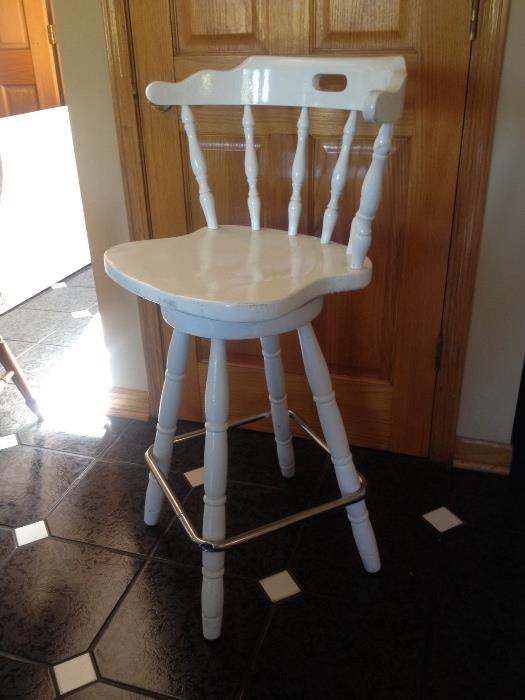 White bar stools.  Cushions included