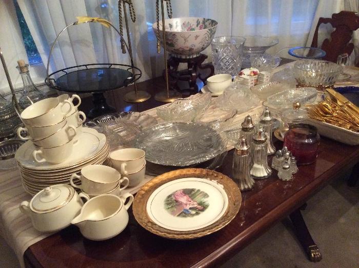 Serving pieces, china, glass ware, Beautiful dining set with hutch, 6 chairs, glass back cabinet with four doors that open amazing storage piece. 
