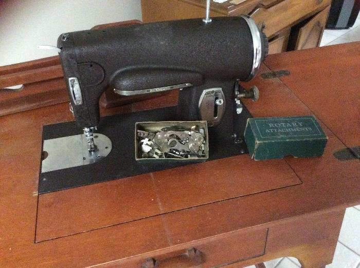 Sewing machine, feet and other exchangeable parts and still has operating book!
