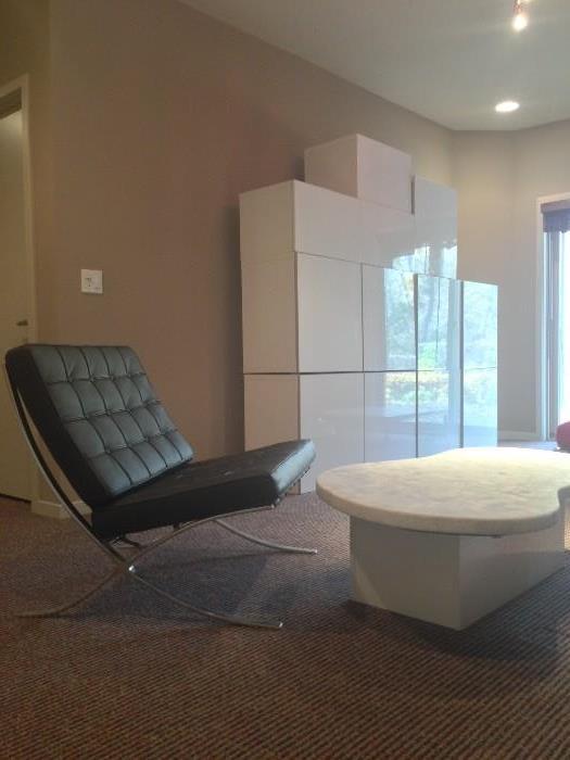 Barcelona style chair, marble coffee table, modular entertainment unit