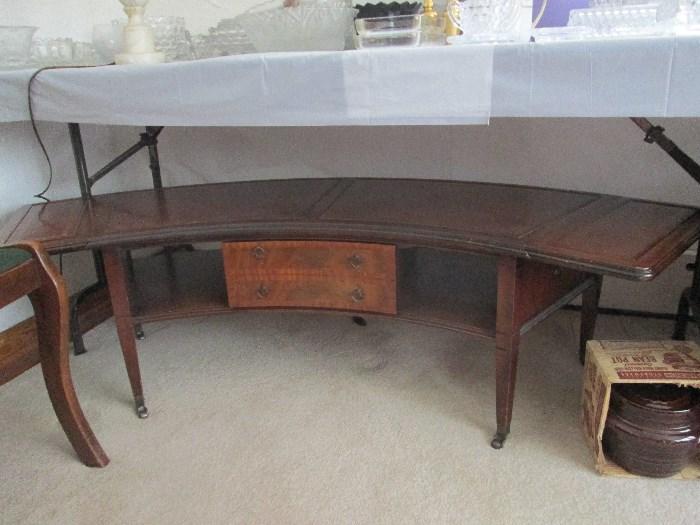 "Regency" style curved drop leaf coffee table with leather top