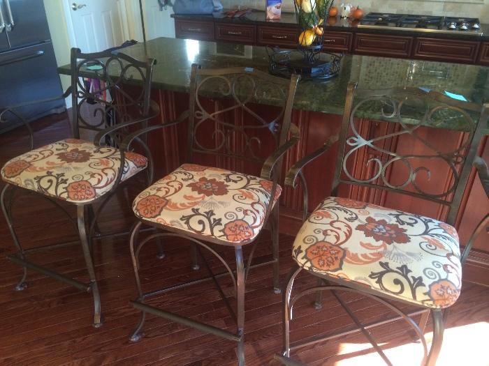 three counter height bars stools -