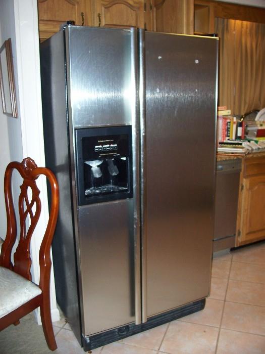 Very clean stainless side by side fridge with ice/water on the door. Works great.