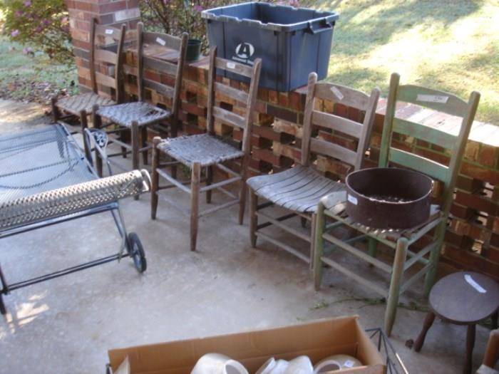 Many primitive chairs and outside furniture.  Antique Loom