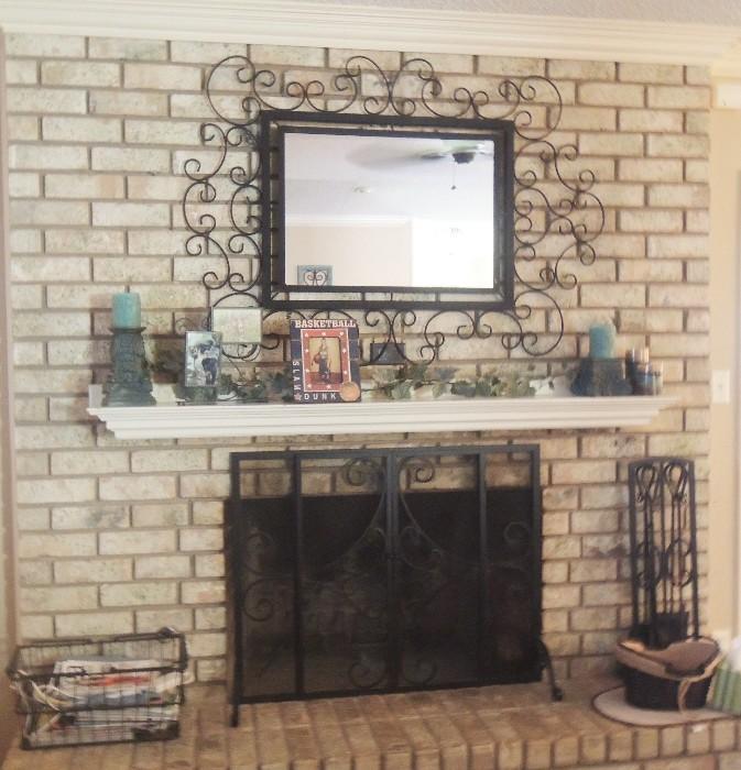 Fireplace decor including mirror, frames, candles and other decor items