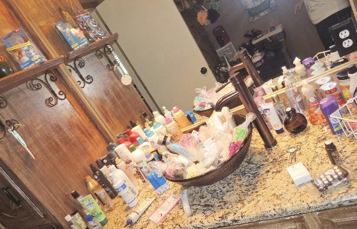 Bathroom & drug store items: hair dryers, curling irons, flatners.  Shampoos & lotions & make up