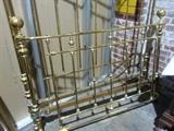 Unusual 100 year old full size brass bed. In excellent condition.