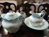 Beautiful pitcher and wash bowl and matching Chamber pot.