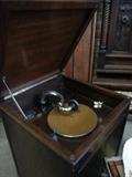 1928 Victrola record player. This is in a floor cabinet with the crank on right side.