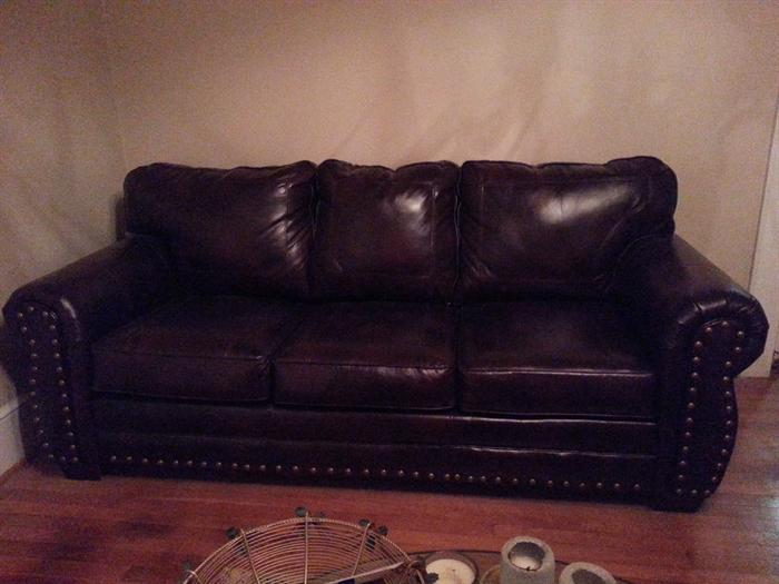 Contemporary leather sofa in tobacco brown.