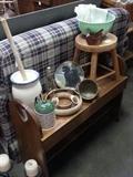 Pine bench with hearts on each end and Fire King green bowl, decorative butter churn, flower ring,