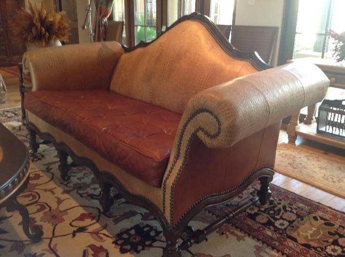 Robb & Stuckey leather sofa with tufted seat, handwoven Tribal rug from Azadi